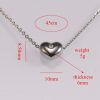 Fashion jewellery heart shape pendant with a shiny white stone