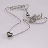 Fashion jewellery heart shape pendant with a shiny white stone